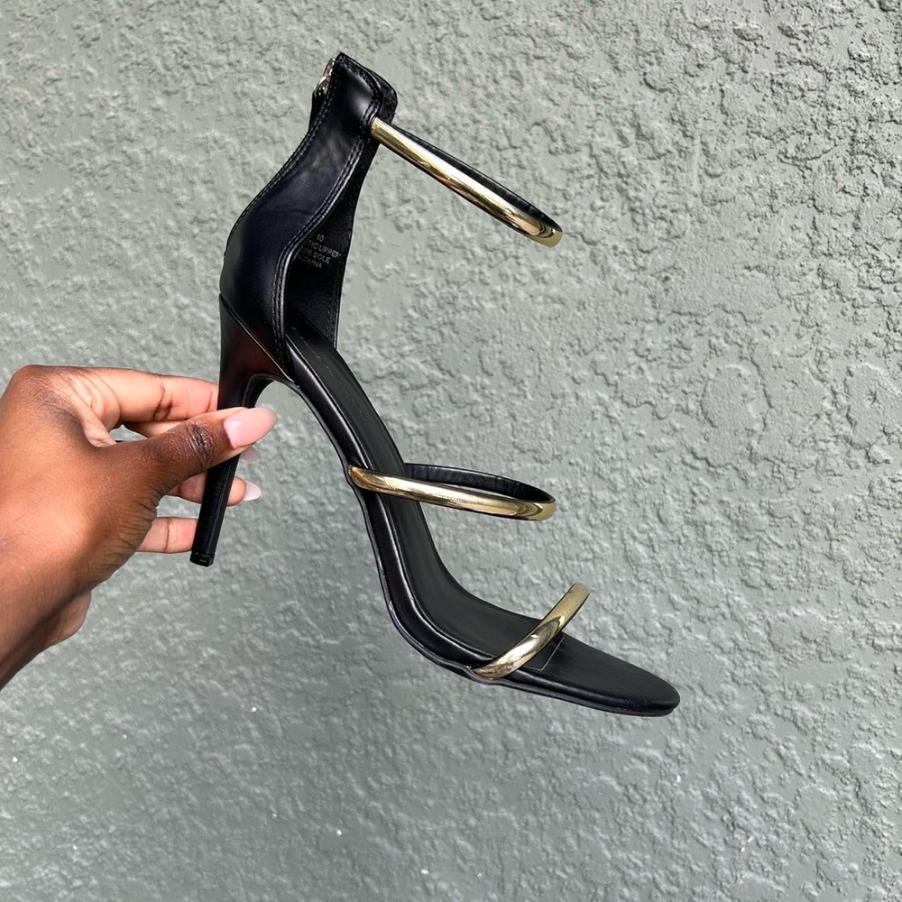 Bebe Black and Gold Strappy Heels
